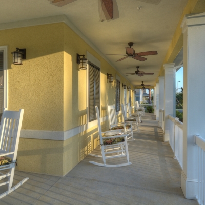 breezeway with white rocking chairs