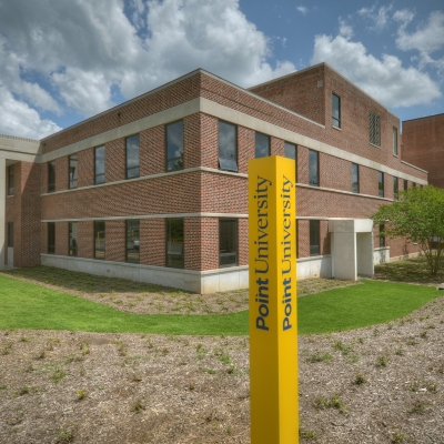 Point University exterior photo with logo on post